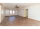 Spacious living room featuring a ceiling fan and large window at 218 Illinois St, Shirley, IN 47384