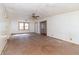 Spacious living room featuring a ceiling fan and glass panel doors at 218 Illinois St, Shirley, IN 47384