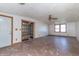 Spacious living room featuring a ceiling fan and glass panel doors at 218 Illinois St, Shirley, IN 47384