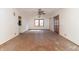 Spacious living room featuring a ceiling fan and glass panel doors at 218 Illinois St, Shirley, IN 47384