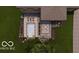 An aerial view of the backyard with pool, landscaping, patio, and outdoor dining at 2428 S Morgantown Rd, Greenwood, IN 46143