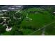 An aerial view shows a luxury house with an expansive green lot with easy access to local schools at 2428 S Morgantown Rd, Greenwood, IN 46143