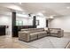 Finished basement featuring a plush sectional sofa, movie projector, sleek bar area, and stylish flooring at 2428 S Morgantown Rd, Greenwood, IN 46143