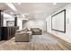 Relaxing basement featuring a sectional sofa, large screen, stylish rug, sleek bar and durable flooring at 2428 S Morgantown Rd, Greenwood, IN 46143