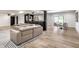 Finished basement with sectional sofa, wet bar, dining area, and light wood grain flooring at 2428 S Morgantown Rd, Greenwood, IN 46143