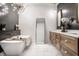 Beautiful bathroom with a freestanding tub, modern lighting, and double vanities at 2428 S Morgantown Rd, Greenwood, IN 46143