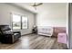 Cozy Bedroom featuring neutral decor, a comfortable rocking chair, and a charming crib, perfect for a new baby at 2428 S Morgantown Rd, Greenwood, IN 46143