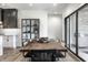 Dining room featuring a wood table, stylish chairs, modern lighting, and sliding glass doors at 2428 S Morgantown Rd, Greenwood, IN 46143