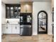 Kitchen featuring stainless steel refrigerator, white cabinets, and a pantry with glass door at 2428 S Morgantown Rd, Greenwood, IN 46143