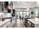 Modern kitchen with stainless steel appliances, a gas range, white cabinets, and natural light at 2428 S Morgantown Rd, Greenwood, IN 46143
