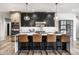 Modern kitchen featuring stainless steel appliances, a center island with bar stools, and elegant pendant lighting at 2428 S Morgantown Rd, Greenwood, IN 46143
