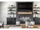 Contemporary fireplace with built-in shelving and cabinets, accented by elegant decor and furnishings at 2428 S Morgantown Rd, Greenwood, IN 46143