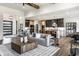 Open-concept living room and kitchen with hardwood floors, modern decor, and ample natural light at 2428 S Morgantown Rd, Greenwood, IN 46143