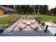 Outdoor kitchen and seating area with built in grill, cooktop, and plentiful counter space at 2428 S Morgantown Rd, Greenwood, IN 46143
