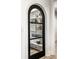 Pantry featuring white shelving, a variety of food items, and a black framed glass door at 2428 S Morgantown Rd, Greenwood, IN 46143