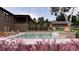 A backyard view featuring a refreshing pool, lush landscaping, and an inviting outdoor ambiance at 2428 S Morgantown Rd, Greenwood, IN 46143