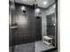 Modern shower featuring sleek black tiles, dual shower heads, glass enclosure, and a built-in bench for a spa-like experience at 2428 S Morgantown Rd, Greenwood, IN 46143