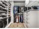 Organized walk-in closet with custom shelving, drawers, and ample hanging space, ensuring efficient storage and easy access at 2428 S Morgantown Rd, Greenwood, IN 46143