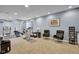 Finished basement area features exercise equipment, seating area and built-in storage at 2468 Wyndham S Pl, Columbus, IN 47203