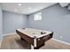 Finished basement featuring an air hockey table and neutral decor at 2468 Wyndham S Pl, Columbus, IN 47203
