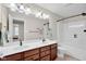 Bathroom featuring double sink, bath tub and a walk in shower at 2468 Wyndham S Pl, Columbus, IN 47203
