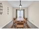 Formal dining room with a wooden table set for six, elegant chandelier, and sophisticated decor at 2468 Wyndham S Pl, Columbus, IN 47203