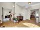 Inviting foyer with hardwood floors, stylish console table, and views into the living spaces at 2468 Wyndham S Pl, Columbus, IN 47203