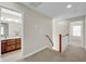 Second floor hallway featuring a view of the bathroom and a bedroom at 2468 Wyndham S Pl, Columbus, IN 47203