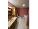 Bathroom features a vanity, tile flooring, and a jetted tub, creating a functional and comfortable space at 2690 Trailridge Ct, Martinsville, IN 46151