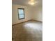 Bedroom features neutral carpet and a window, creating a comfortable and inviting space to relax and unwind at 2690 Trailridge Ct, Martinsville, IN 46151