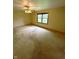 Bedroom with a ceiling fan and a window overlooks a scenic green yard, creating a peaceful retreat at 2690 Trailridge Ct, Martinsville, IN 46151