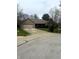 A brick home featuring an attached garage, complemented by a green lawn and paved driveway at 2690 Trailridge Ct, Martinsville, IN 46151