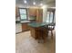 Bright kitchen features an island with stools and plenty of counter space at 2690 Trailridge Ct, Martinsville, IN 46151