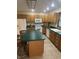 Inviting kitchen featuring an island, white appliances, and wood cabinetry at 2690 Trailridge Ct, Martinsville, IN 46151