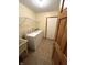 Functional laundry room featuring a washer, dryer, utility sink, and wire shelving for ample storage at 2690 Trailridge Ct, Martinsville, IN 46151