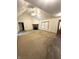 Spacious living room with a fireplace, vaulted ceilings, and plush carpeting, ideal for comfortable living at 2690 Trailridge Ct, Martinsville, IN 46151