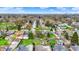 Aerial view reveals residential homes interspersed with established trees and utility lines along a tranquil street at 2828 N Moreland Ave, Indianapolis, IN 46222