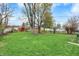 Image of a home's backyard featuring mature trees, a privacy fence, and multiple sheds at 2828 N Moreland Ave, Indianapolis, IN 46222