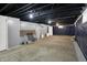 Unfinished basement with vapor barrier along walls and essential mechanical features at 2828 N Moreland Ave, Indianapolis, IN 46222