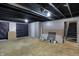 Spacious unfinished basement with exposed ceiling and a stairwell at 2828 N Moreland Ave, Indianapolis, IN 46222