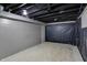 Unfinished basement featuring concrete floors and partial vapor barrier walls at 2828 N Moreland Ave, Indianapolis, IN 46222