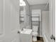 Bathroom with a modern vanity, a toilet, and a shower/tub combo with tile surround at 2828 N Moreland Ave, Indianapolis, IN 46222