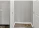 Walk-in closet with wood-look floor and access to utilities at 2828 N Moreland Ave, Indianapolis, IN 46222