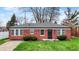 Charming brick home featuring a well-manicured lawn and cozy front garden at 2828 N Moreland Ave, Indianapolis, IN 46222