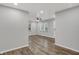 Bright living room with wood-look floors, neutral walls and a ceiling fan at 2828 N Moreland Ave, Indianapolis, IN 46222