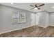 Cozy living room featuring modern flooring, fresh paint, and a ceiling fan at 2828 N Moreland Ave, Indianapolis, IN 46222