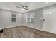 Bright living room with hardwood floors, a ceiling fan, and natural light at 2828 N Moreland Ave, Indianapolis, IN 46222