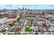 An aerial photograph displays a neighborhood next to a city skyline and commercial buildings, under an open blue sky at 305 Sanders St, Indianapolis, IN 46225