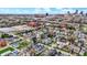 An aerial view displaying a neighborhood next to a cityscape, featuring colorful homes and multiple commercial buildings at 305 Sanders St, Indianapolis, IN 46225