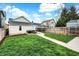 Lush backyard featuring a walkway, patio, and well-maintained lawn, perfect for outdoor enjoyment at 305 Sanders St, Indianapolis, IN 46225